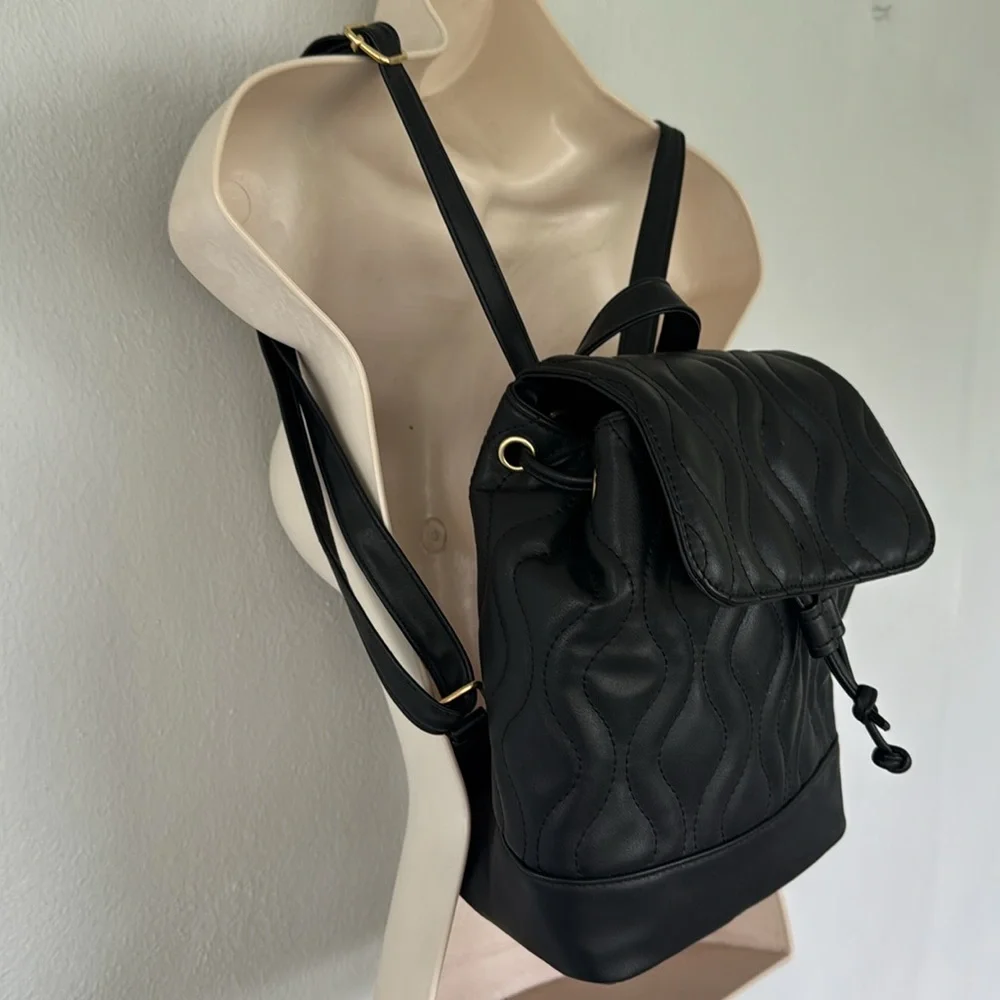 Alexis Bendel black quilted vegan leather adjustable backpack